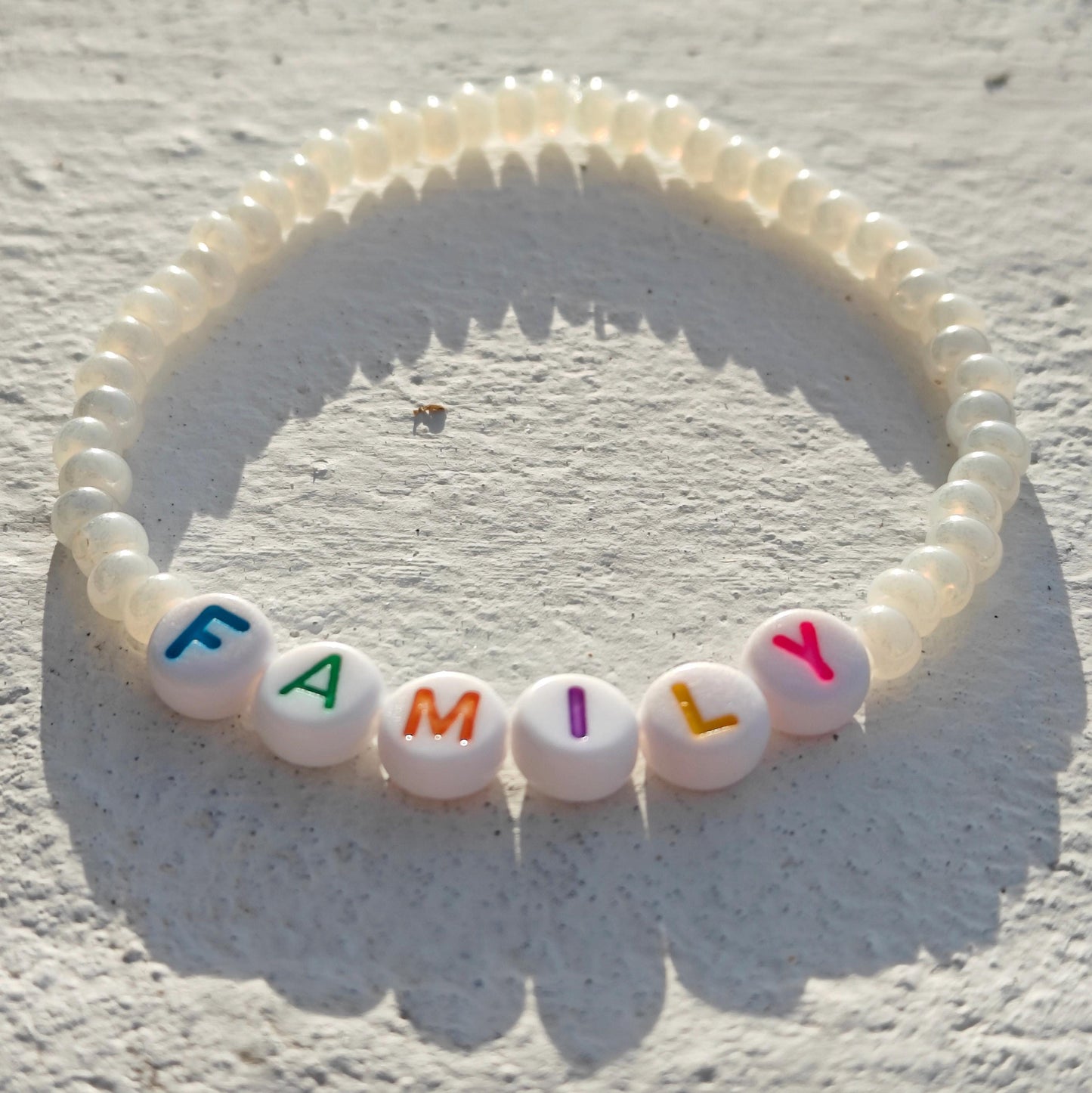 Family bead bracelet in pearl style seed beads with multicolored letters