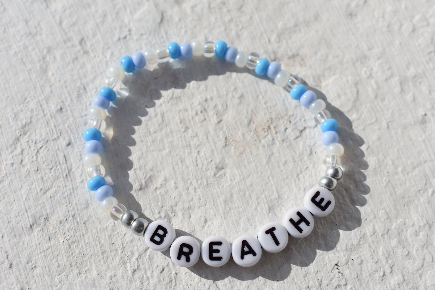 Breathe bead bracelet in blue and silver
