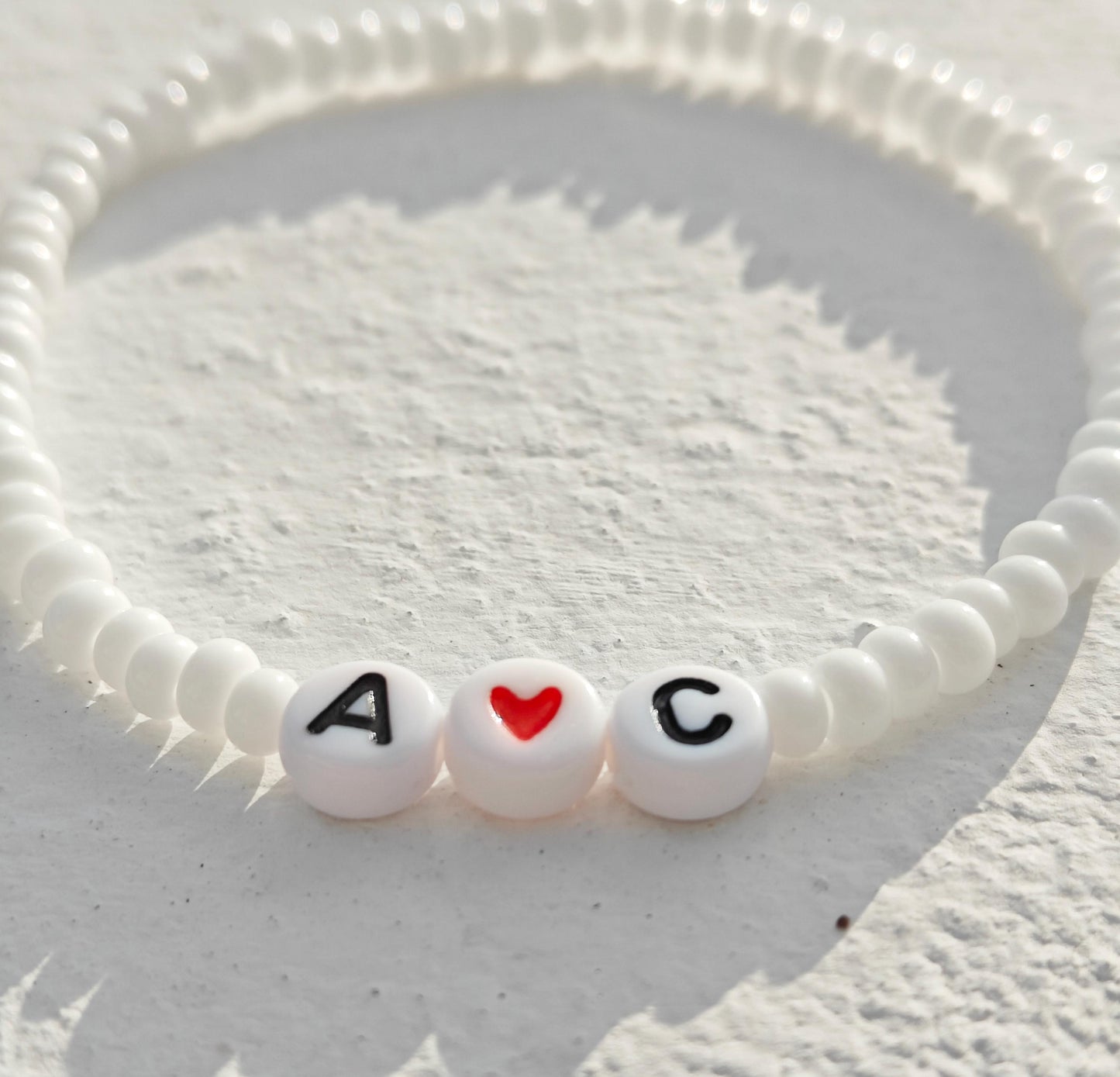 Cute love heart and initial white bead bracelet
