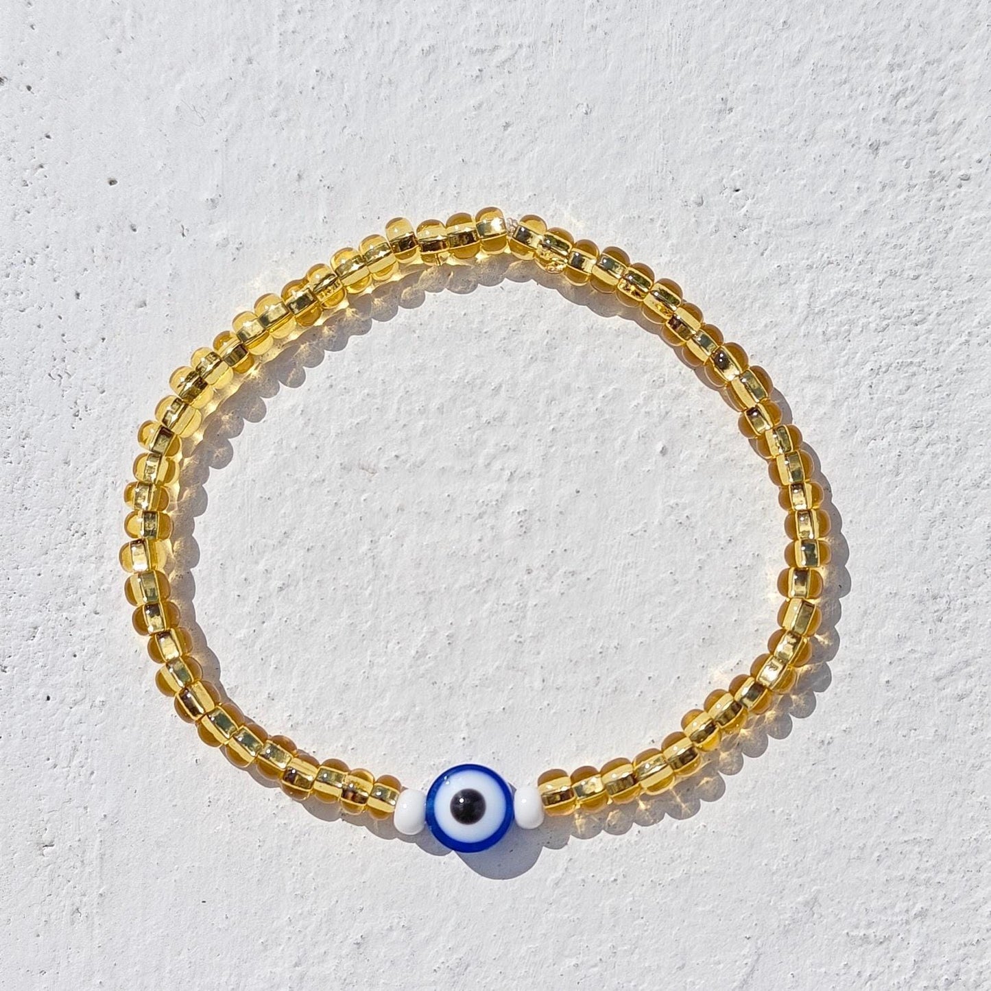 Seed Bead Evil Eye Bracelet – Gold Glass Beads with Blue Centre Charm | Evil Eye Protection | Boho Bracelet