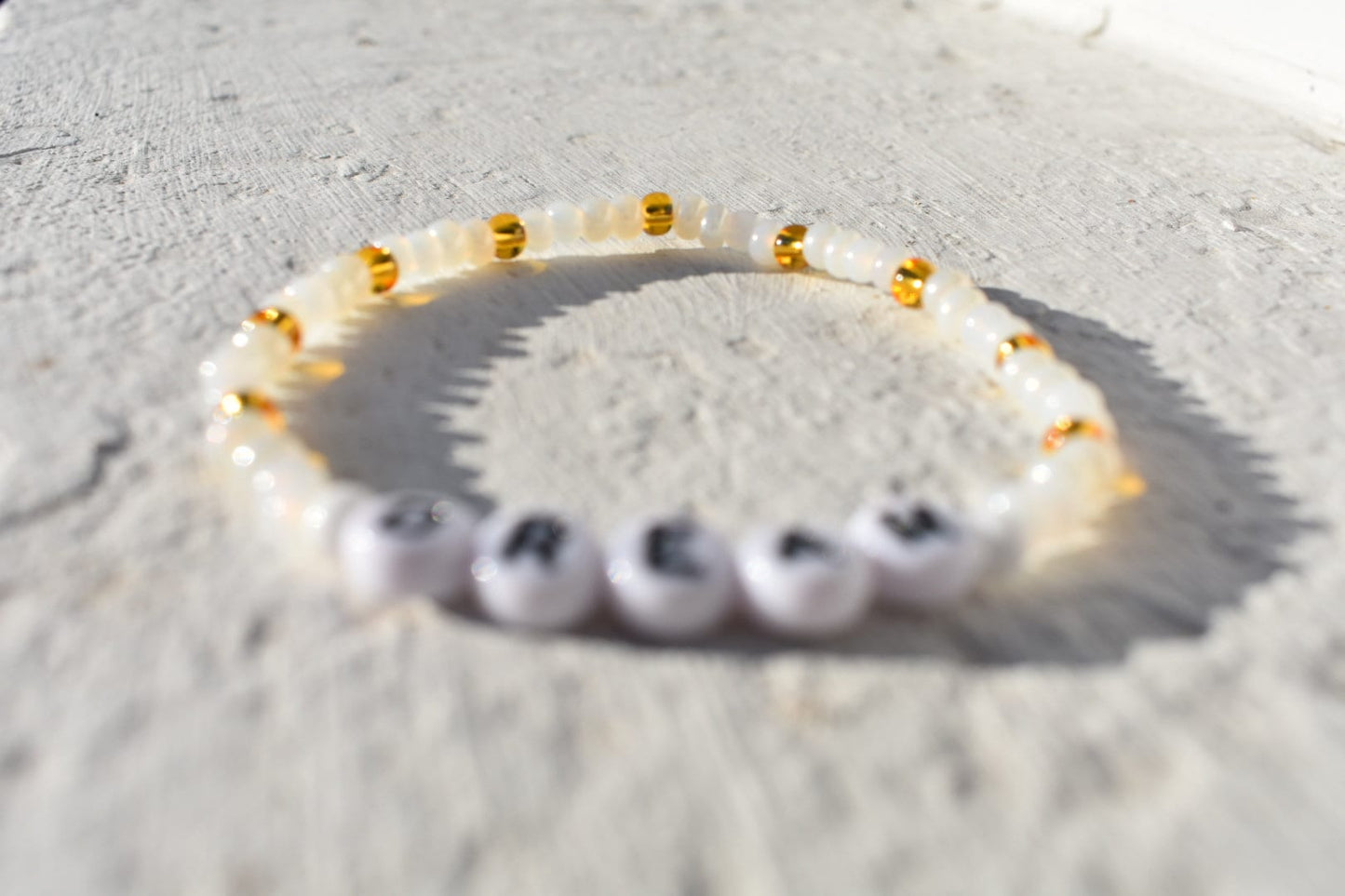 Dream glass seed bead bracelet in shades of pearl, gold and white