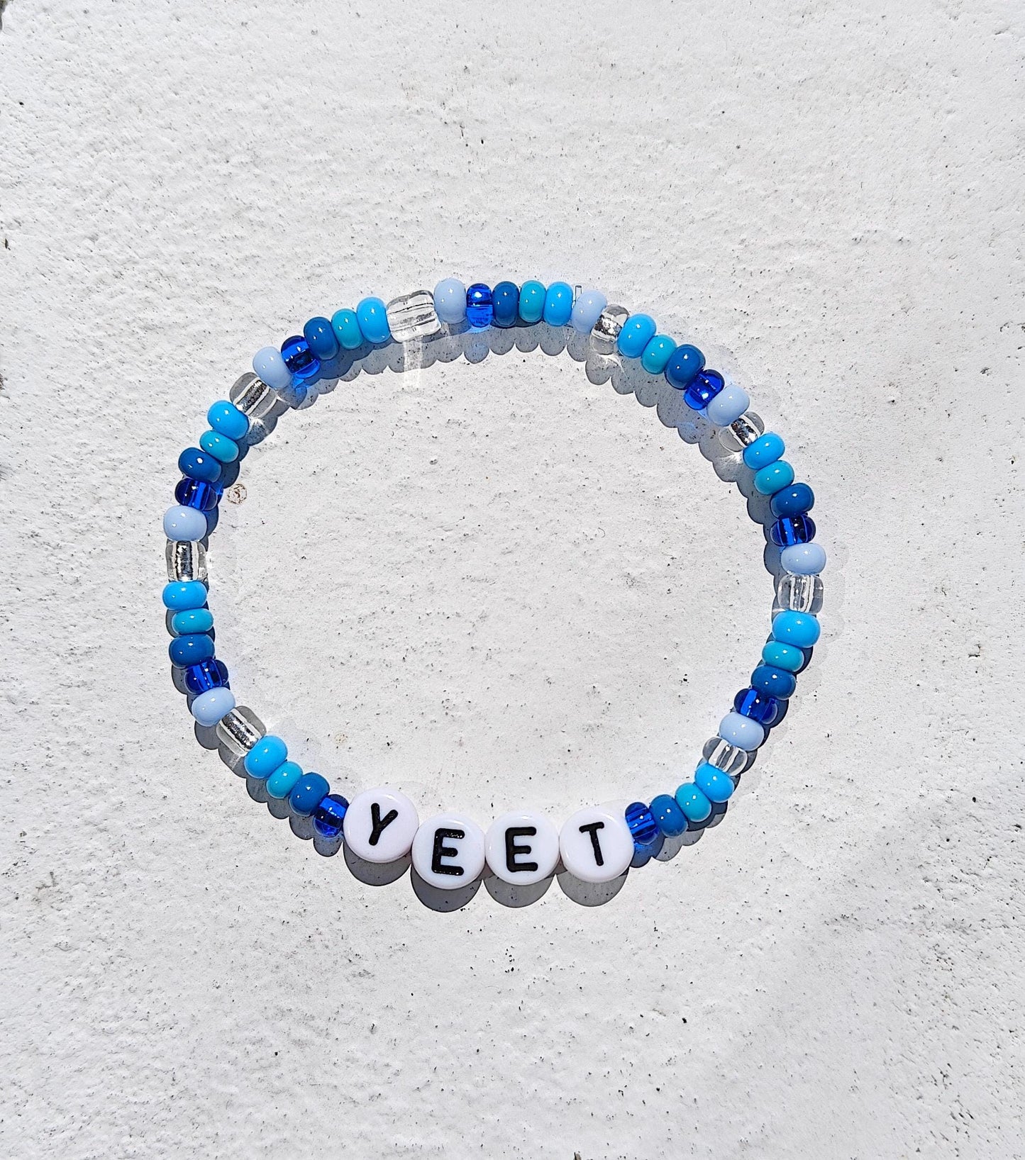 YEET Beaded Bracelet – WWE Inspired Blue & White Stretchy Bracelet | Funny Gift for Wrestling Fans | Meme Jewelry | Handmade Accessory
