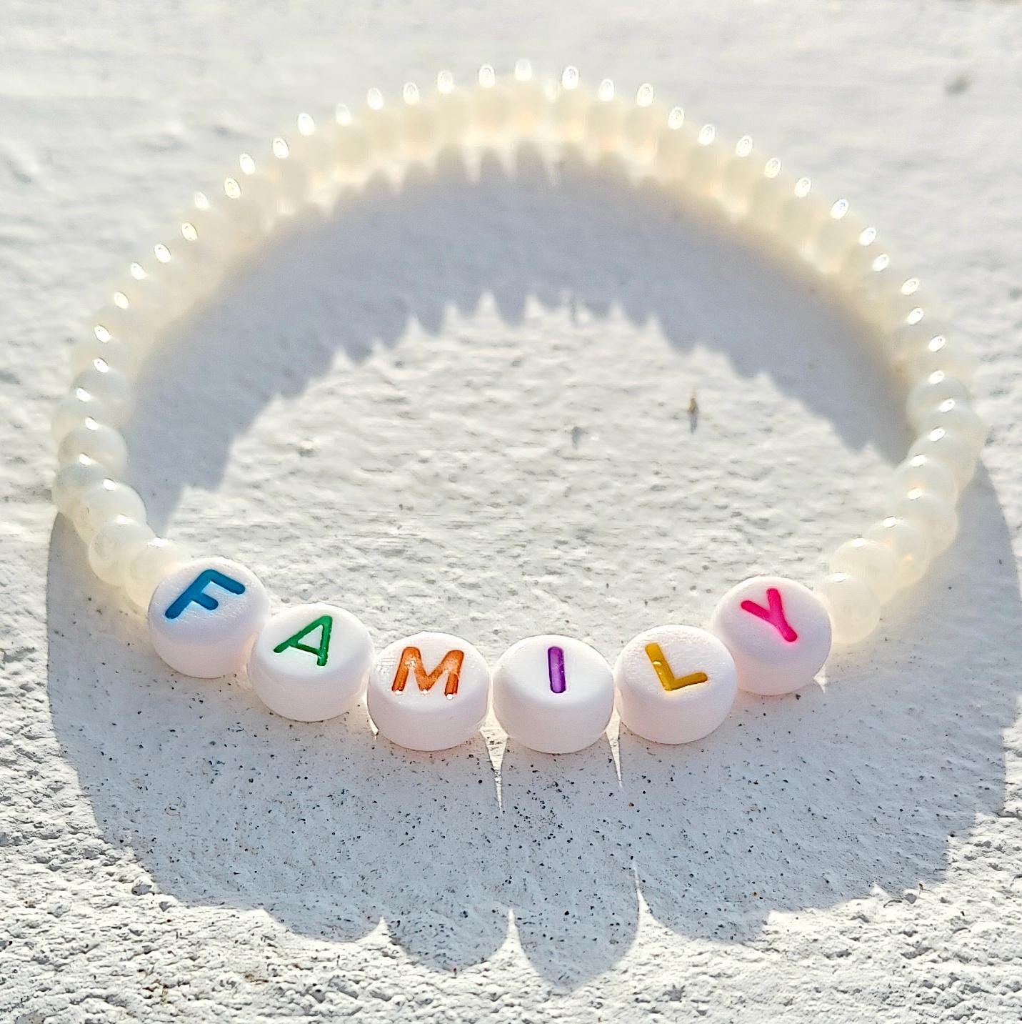 Family bead bracelet in pearl style seed beads with multicolored letters