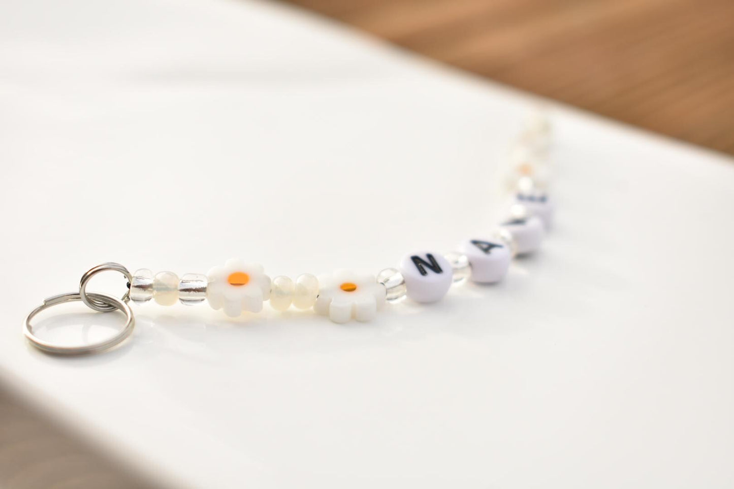 Daisy flower charm keychain with name personalisation and beads in silver and pearl