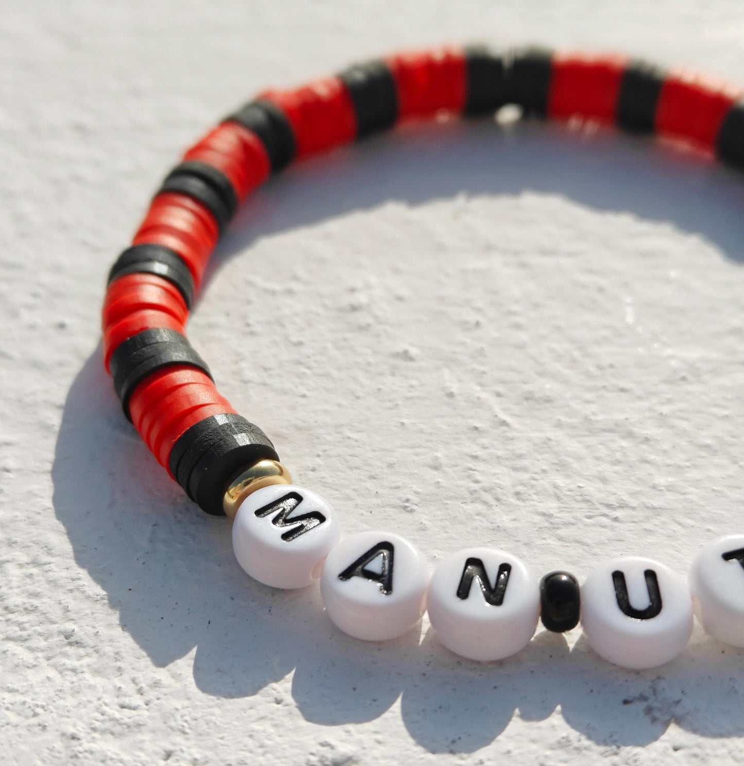 Manchester United football team clay bead bracelet in red and black with gold plated beads