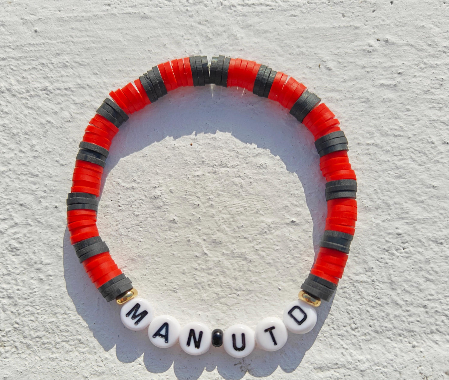 Manchester United football team clay bead bracelet in red and black with gold plated beads